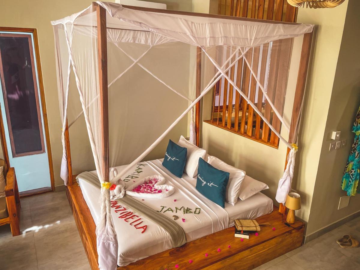 Zanzibella Hotel & Spa Kiwengwa  Extérieur photo A bed with a mosquito net